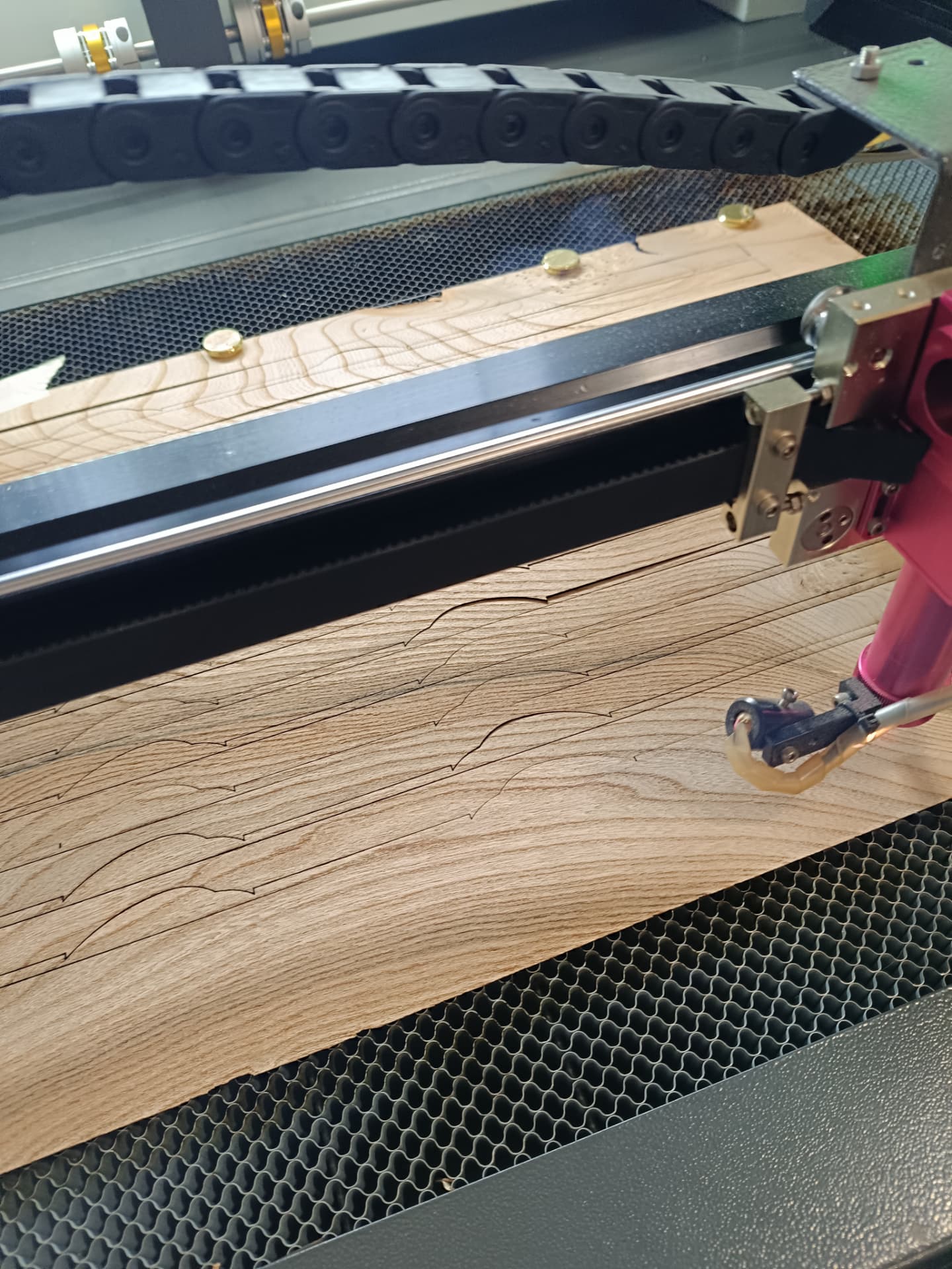 Precision laser cutting of wood veneer